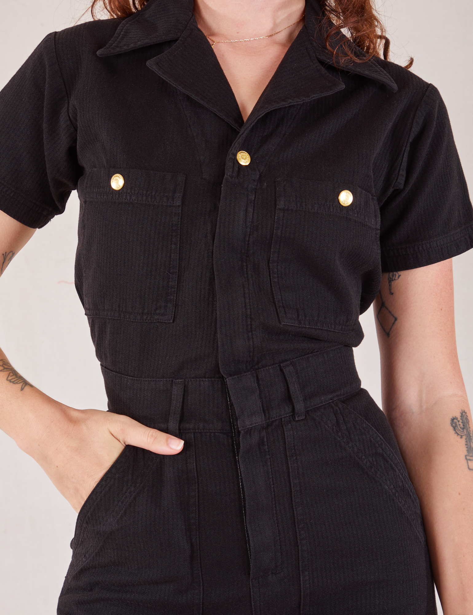 Heritage Short Sleeve Jumpsuit in Basic Black front close up on Alex