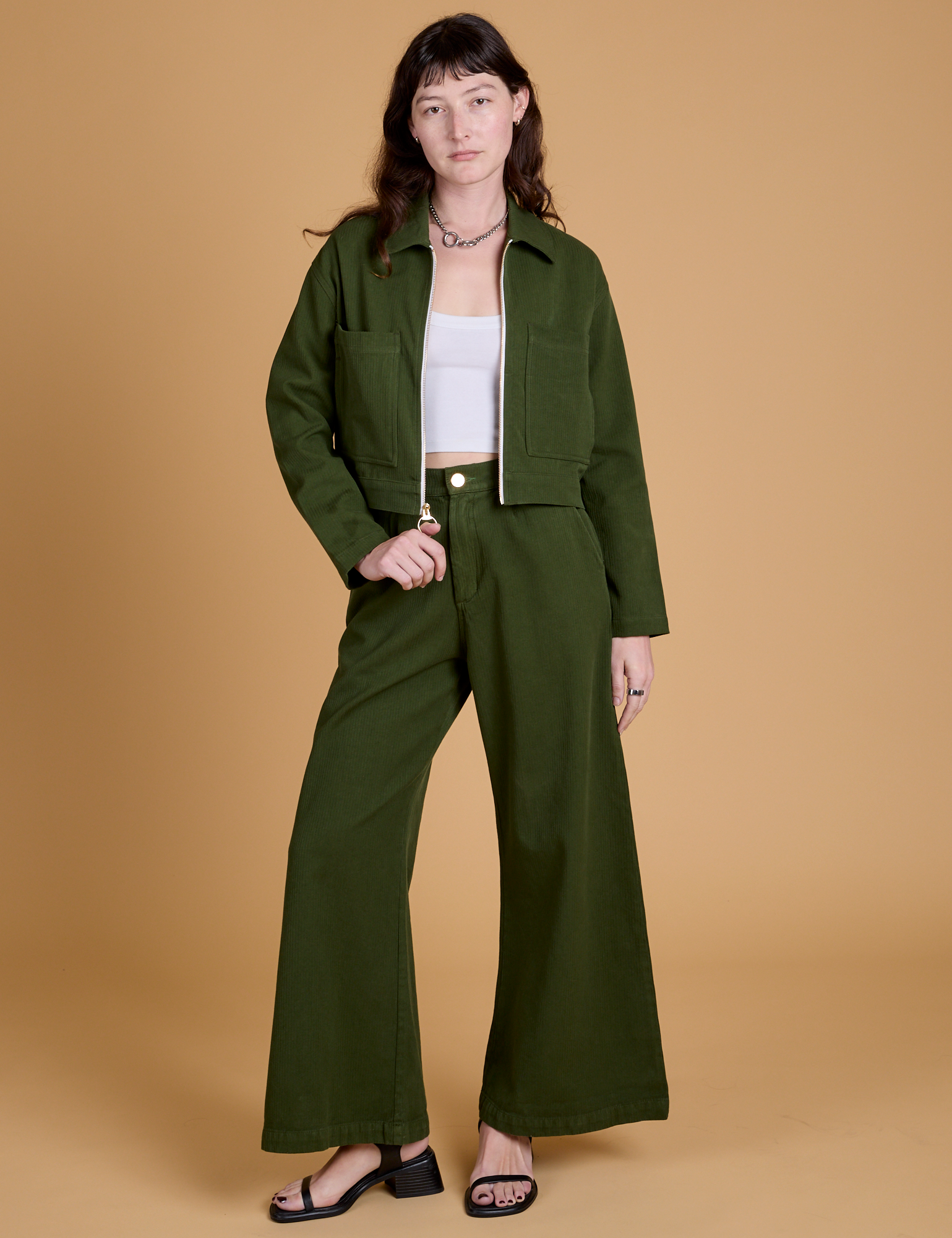 Alex is wearing Heritage Mechanic Jacket in Evergreen and matching Wide Leg Trousers