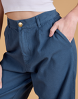 Close up of Alex's hand in the front pocket of Heritage Wide Leg Trousers in French Blue