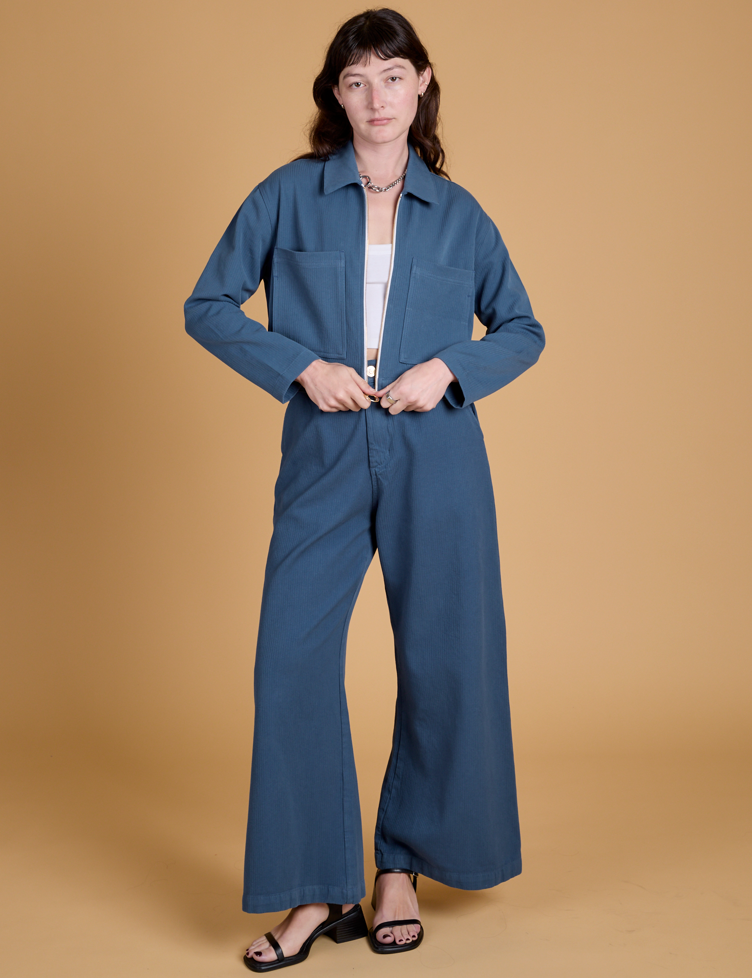 Alex is wearing Heritage Mechanic Jacket in French Blue and matching Wide Leg Trousers