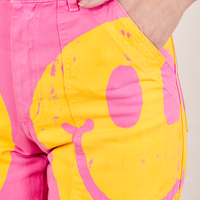 Close up of Icon Work Pants in Smilies. Alex has her hand in the pocket.