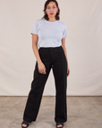 Tiara is wearing JV Tee in Stone White tucked into black Western Pants