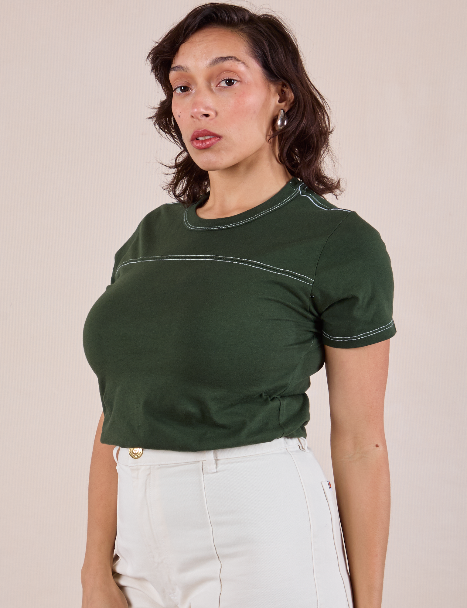 JV Tee in Swamp Green angled front view on Tiara