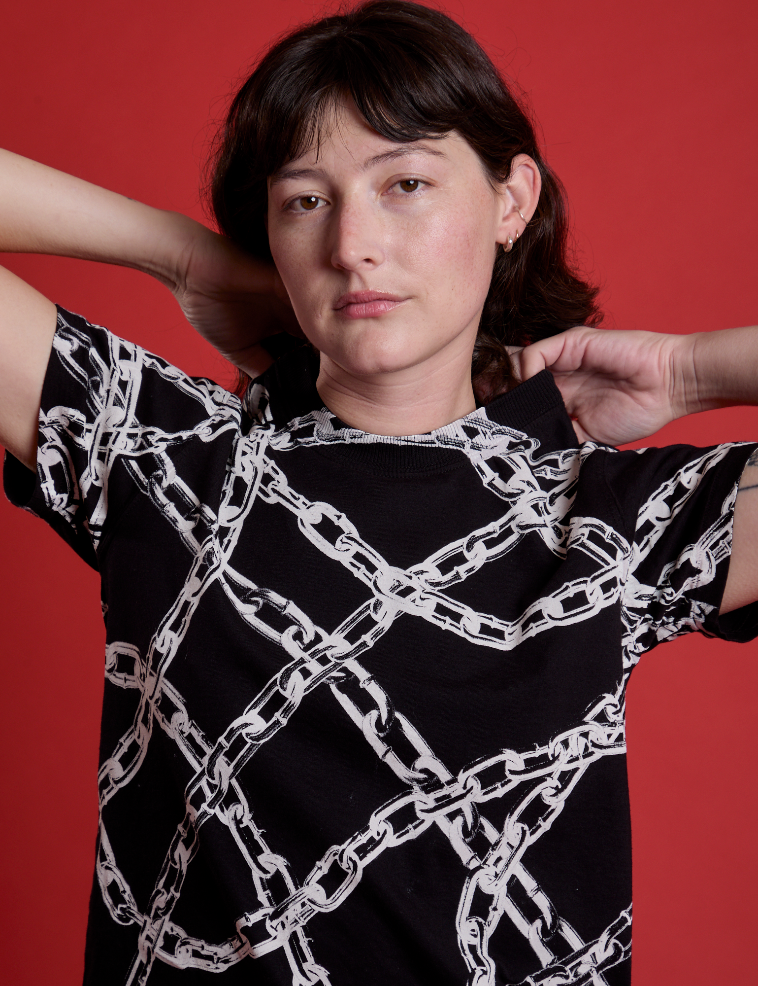 Front close up of Chain Link Vintage Tee in Basic Black on Alex