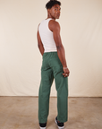 Work Pants in Dark Emerald Green back view on Jerrod wearing vintage off-white Tank Top