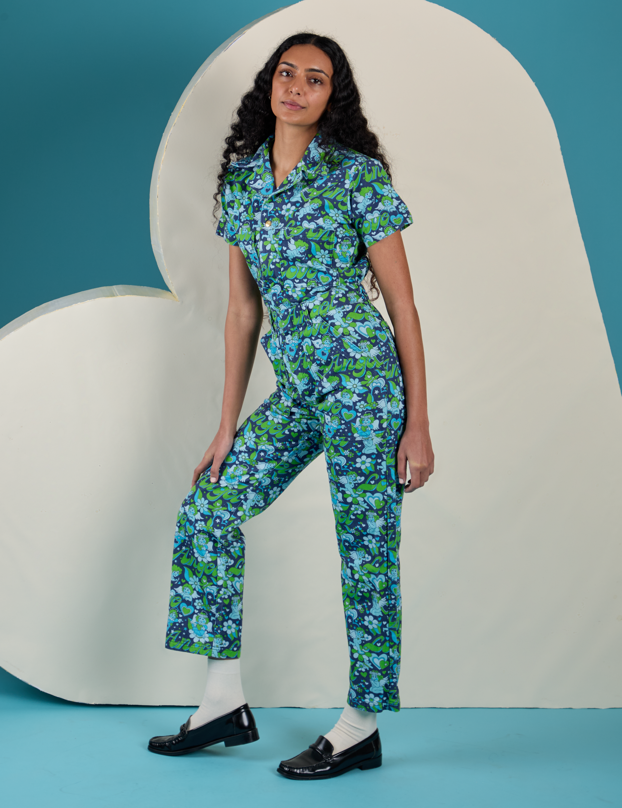 Angled front view of Angel Print Jumpsuit on Shahana