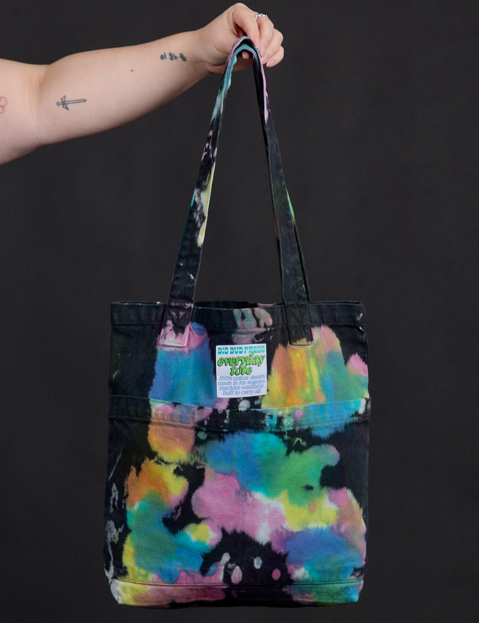 Everyday Tote in Rainbow Magic Waters held by model