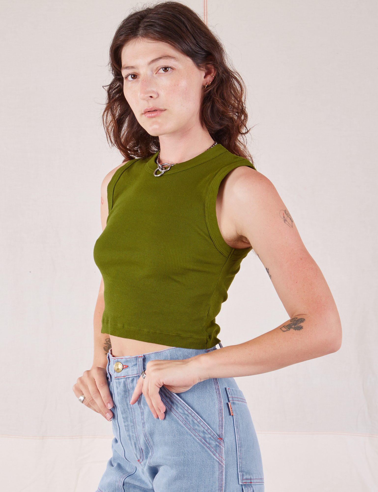 Muscle Tee in Summer Olive angled front view on Alex