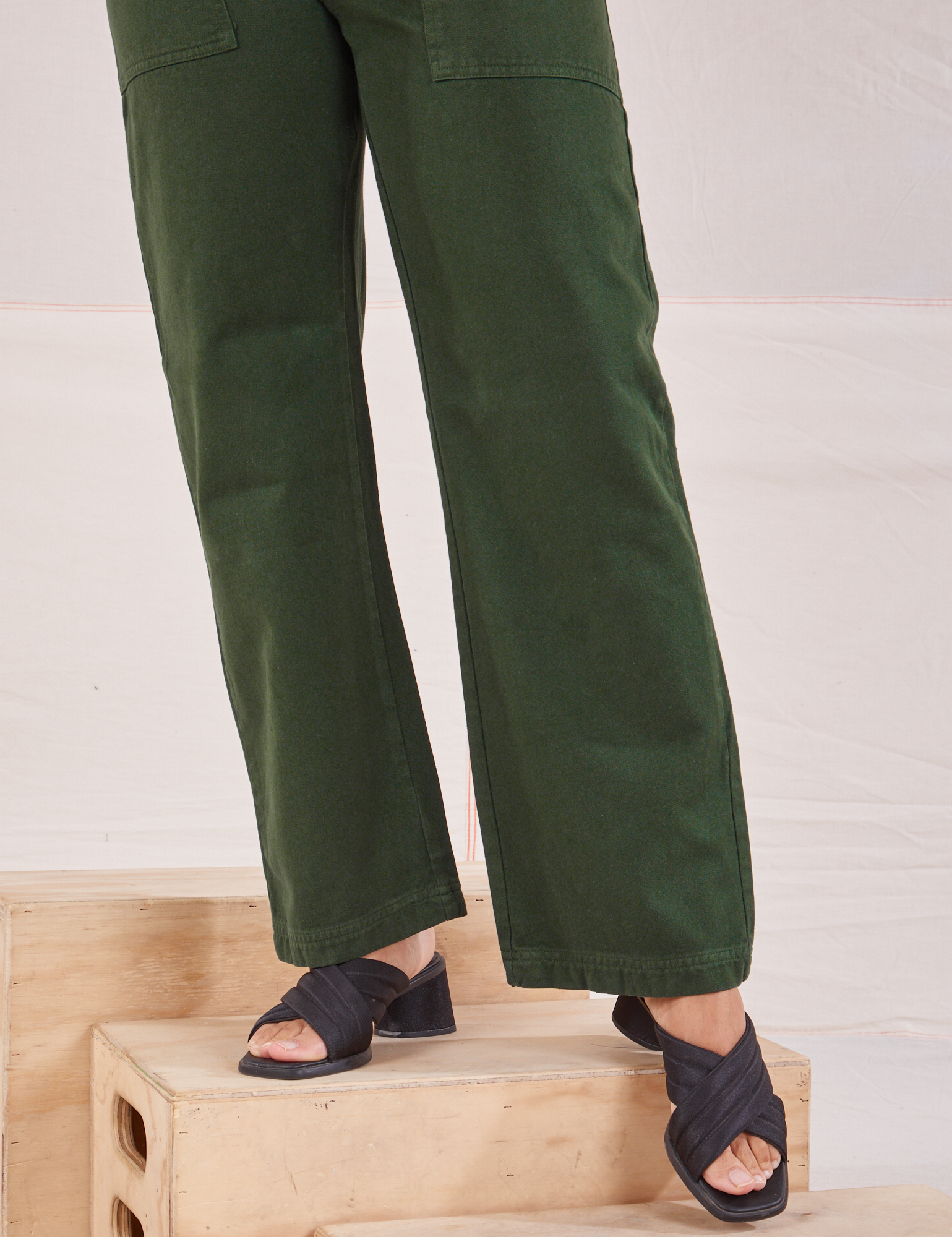 Organic Work Pants in Swamp Green pant leg close up on Tiara