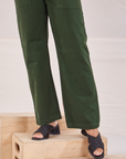 Organic Work Pants in Swamp Green pant leg close up on Tiara