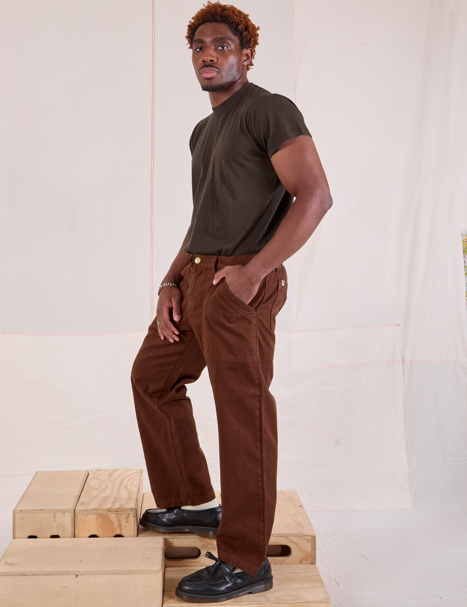 Side view of Mid-Rise Work Pants in Fudgesicle Brown and espresso brown Organic Vintage Tee on Issac