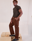 Side view of Mid-Rise Work Pants in Fudgesicle Brown and espresso brown Organic Vintage Tee on Issac