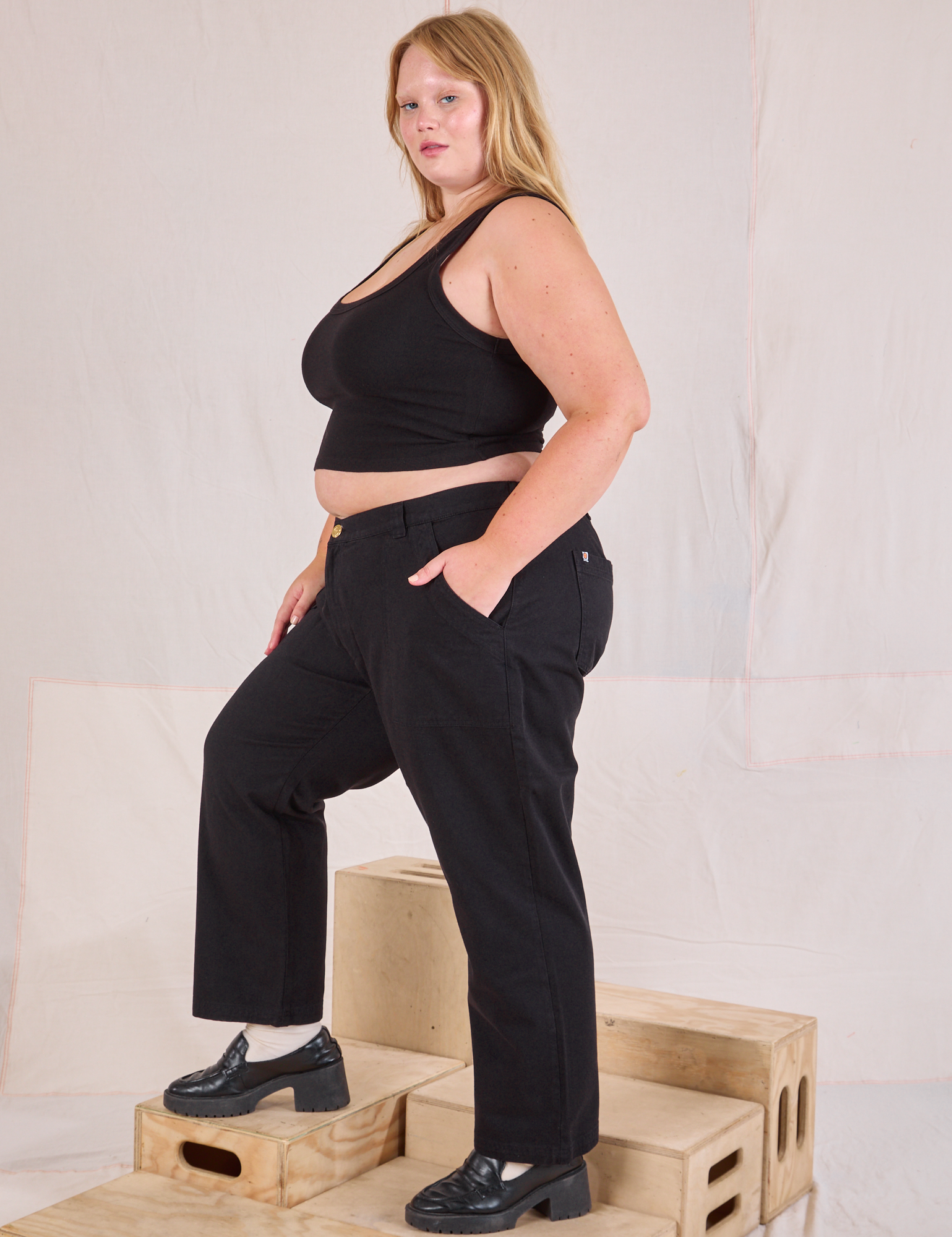 Side view of Mid-Rise Work Pants in Basic Black and black Cropped Tank