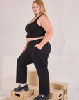 Side view of Mid-Rise Work Pants in Basic Black and black Cropped Tank