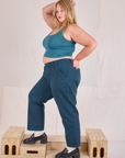 Side view of Mid-Rise Work Pants in Lagoon and marine blue Cropped Tank on Juliet