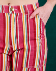 Stripe Work Pants in Cherry Candy front close up. Margaret has her hand in the pocket.