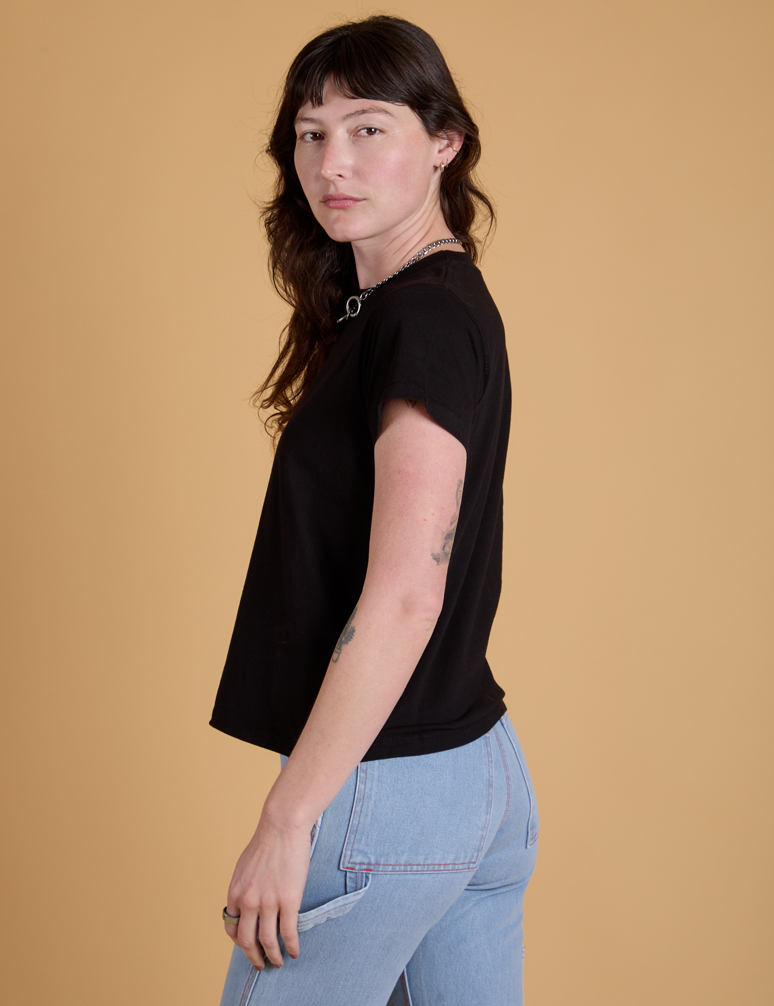 Organic Vintage Tee in Basic Black side view on Alex
