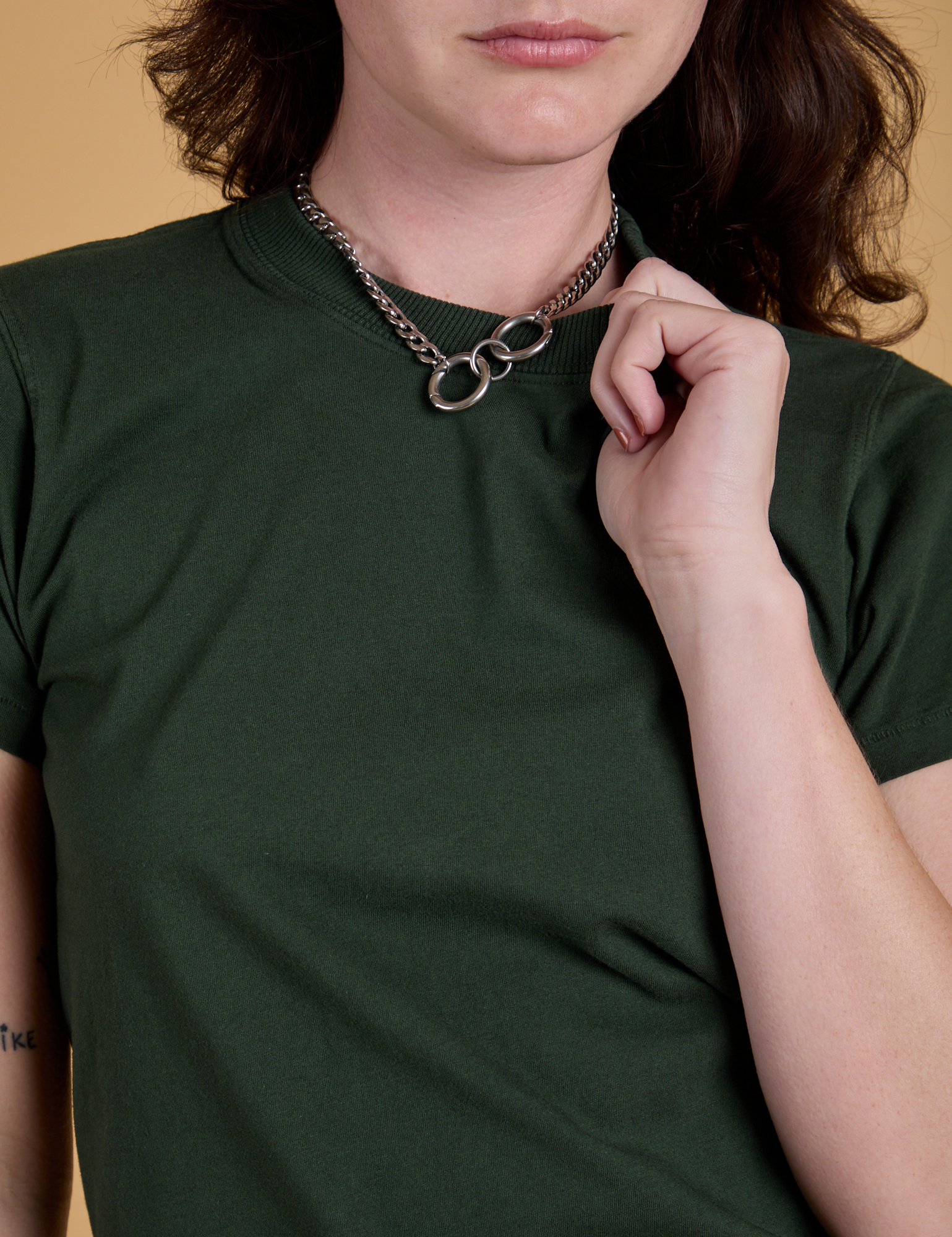 Organic Vintage Tee in Swamp Green front close up on Alex