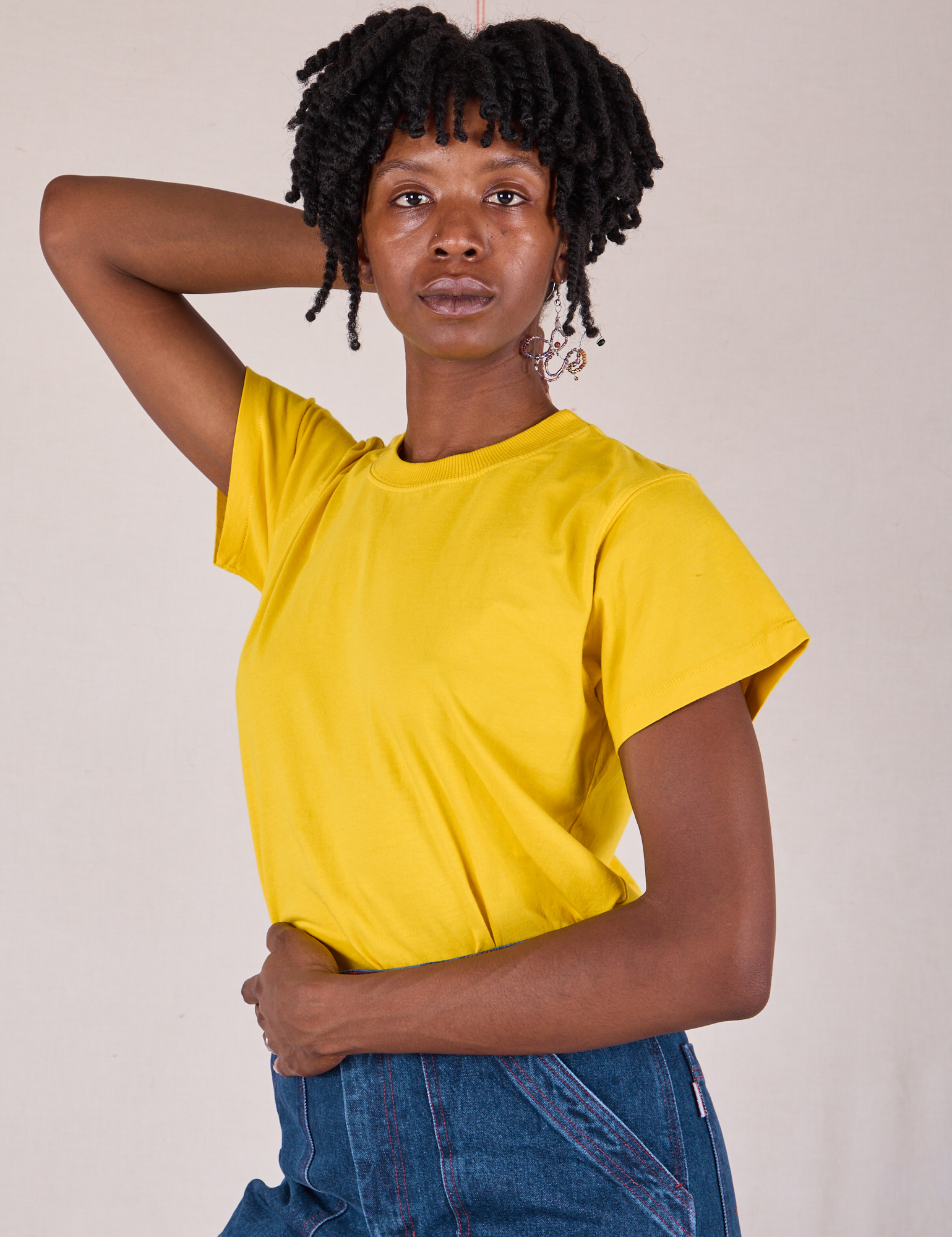 Angled front view of Organic Vintage Tee in Golden Yellow on Cheyann