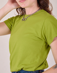 Angled front close up of Organic Vintage Tee in Gross Green on Alex