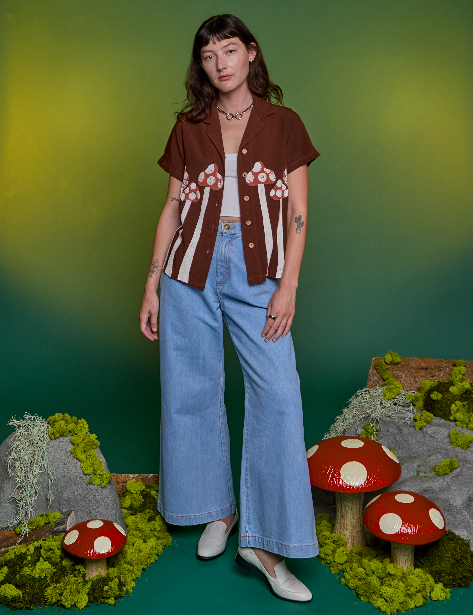 Alex is wearing Paintstamped Pantry Button-Up in Mushroom and light wash Indigo Wide Leg Trousers