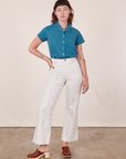 Alex is wearing Pantry Button-Up in Marine Blue and vintage off-white Western Pants