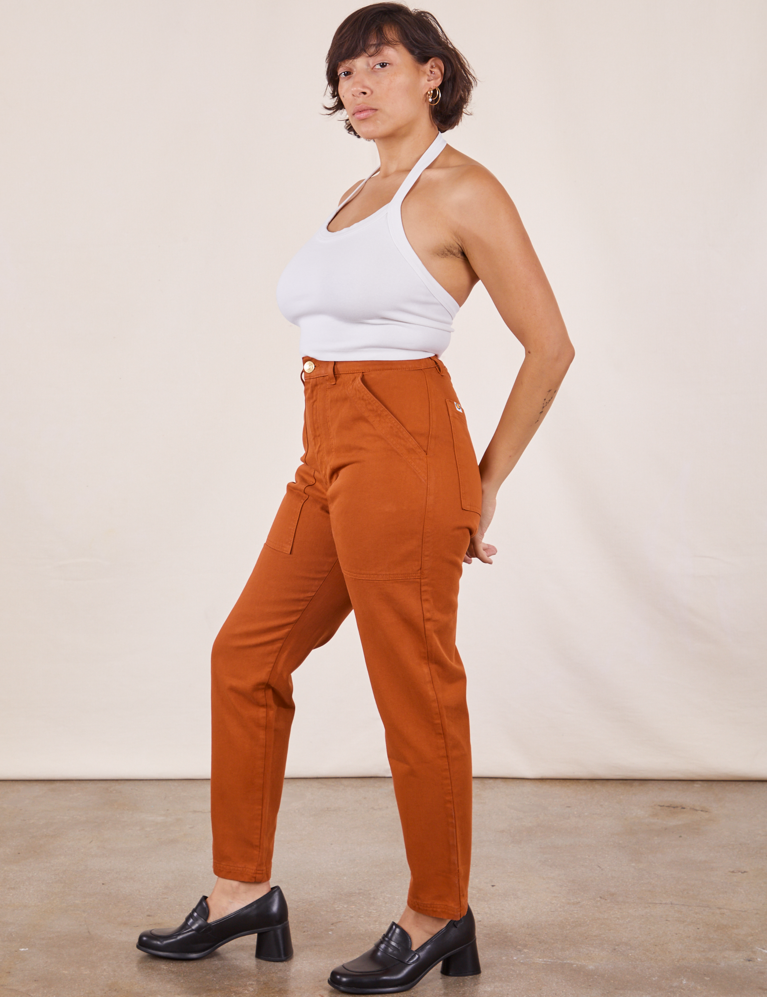 Side view of Pencil Pants in Burnt Terracotta and vintage off-white Halter Top on Tiara