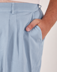 Heavyweight Trousers in Periwinkle front pocket close up. Miguel has his hand in the pocket.