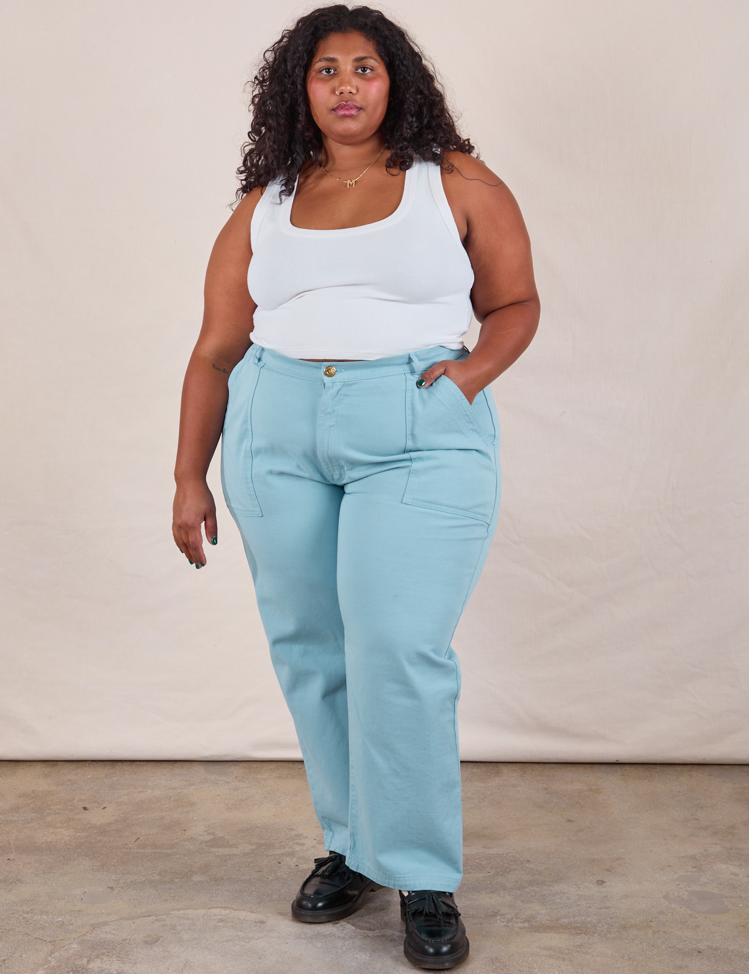 Morgan is wearing Work Pants in Baby Blue and Cropped Tank in vintage tee off-white