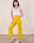 Angled front view of Work Pants in Golden Yellow on Alex