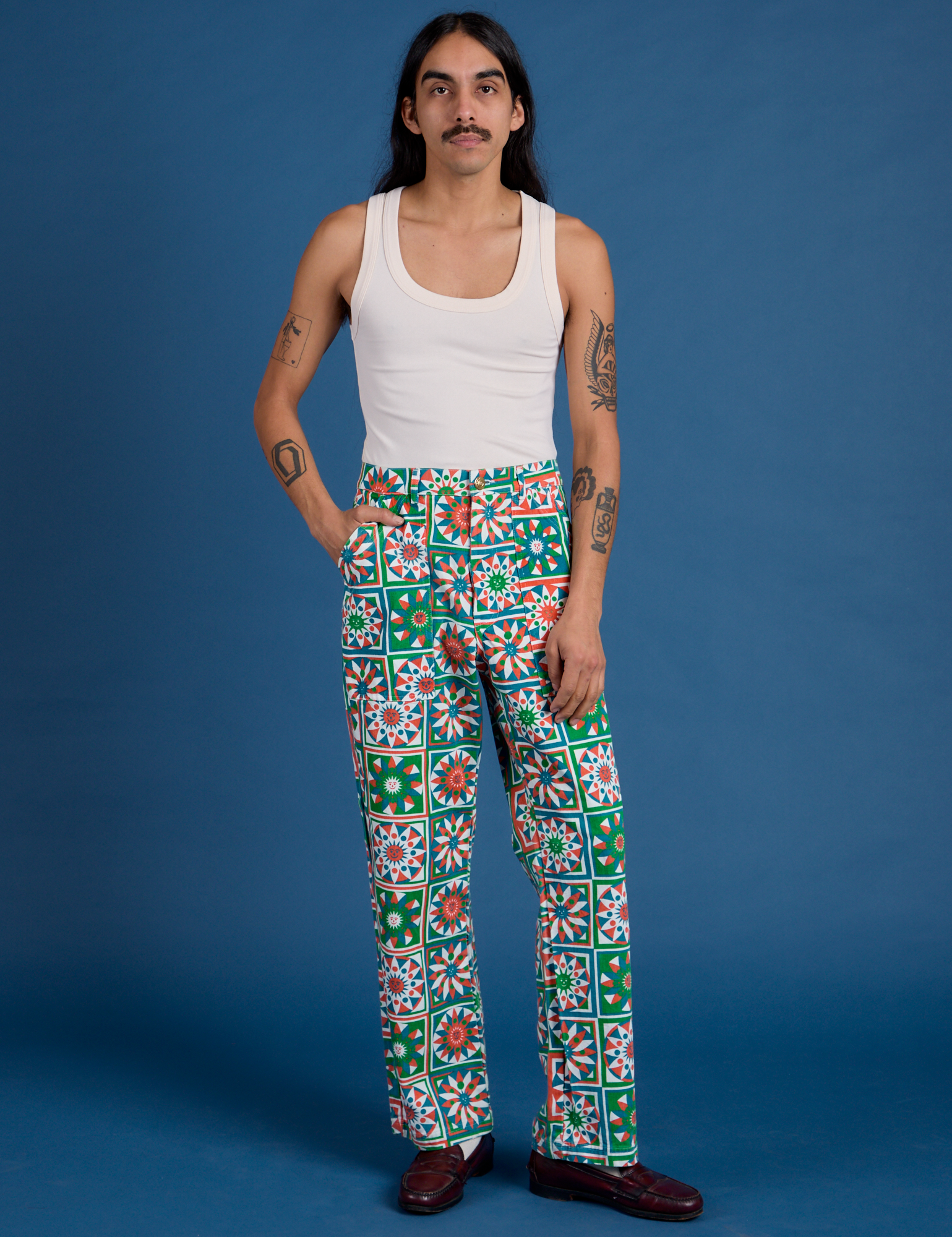 Anthony is 5’6” and wearing S Work Pants in Quilt Print paired with a vintage tee off-white Tank Top