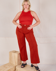 Lish is wearing Racerback Tank in Mustang Red and paprika Western Pants