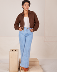 Ricky Jacket in Fudgesicle Brown, a vintage off-white Tank Top and light wash Sailor Jeans worn by Mika