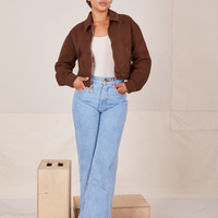 Ricky Jacket in Fudgesicle Brown, a vintage off-white Tank Top and light wash Sailor Jeans worn by Mika