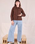 Alex is wearing Ripstop Work Jacket in Fudgesicle Brown and Wide Leg Denim Jeans in Lightwash