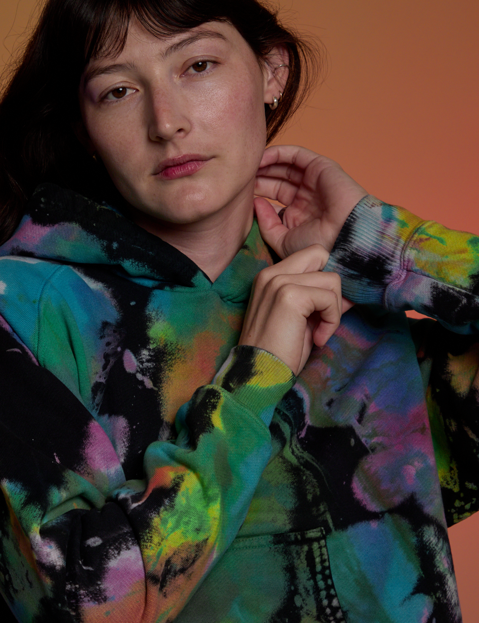 Front close up of Oversized Hoodie in Rainbow Magic Waters on Alex