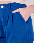 Close up of Alex's hand in the front pocket of Heavyweight Trousers in Royal Blue