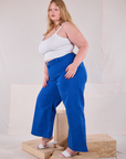 Side view of Bell Bottoms in Royal Blue and Cami in Vintage Tee Off-White on Juliet