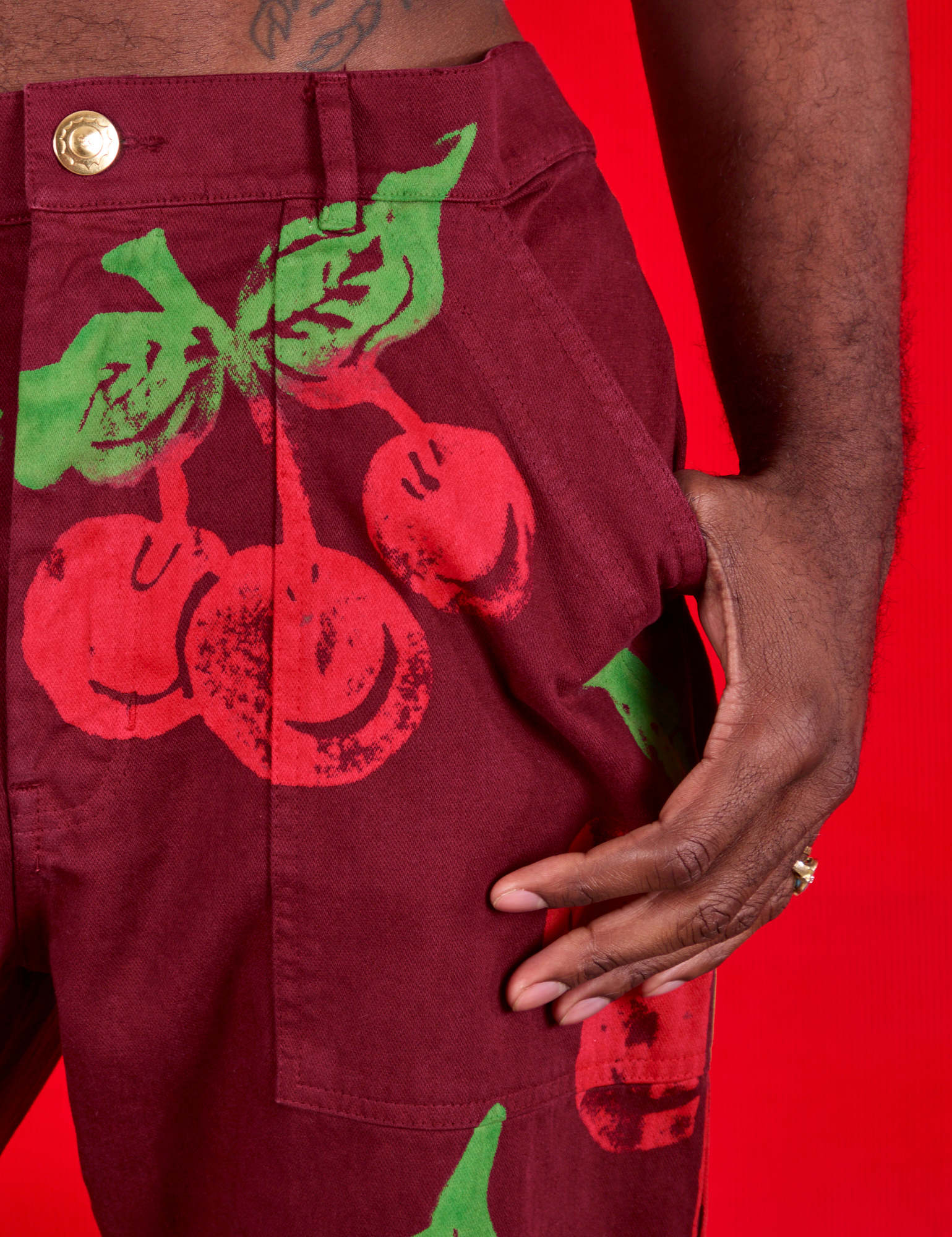 Paintstamped Work Pants in Cherry front pocket close up on Jerrod