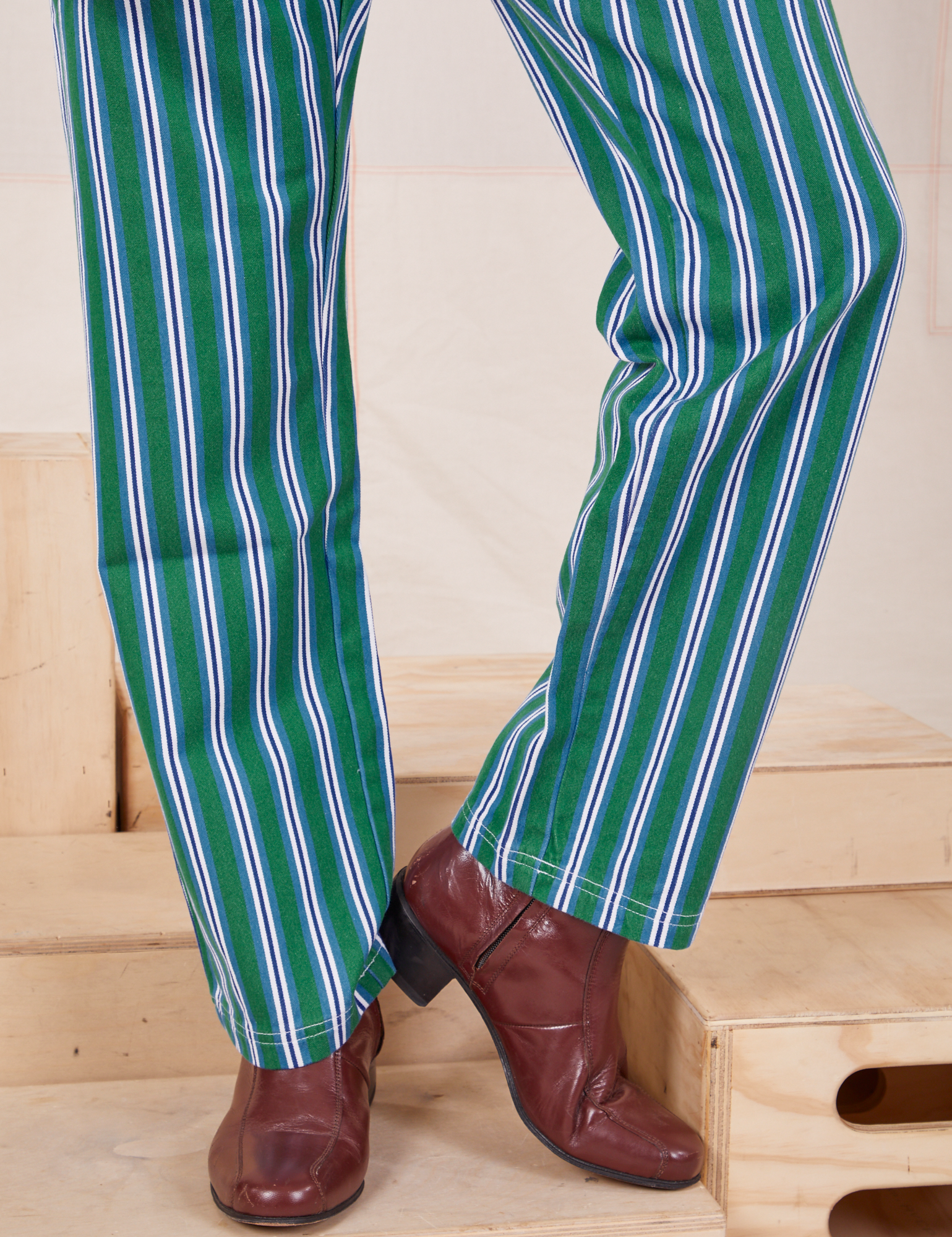 Pant leg close up of Stripe Work Pants in Green worn by Jesse