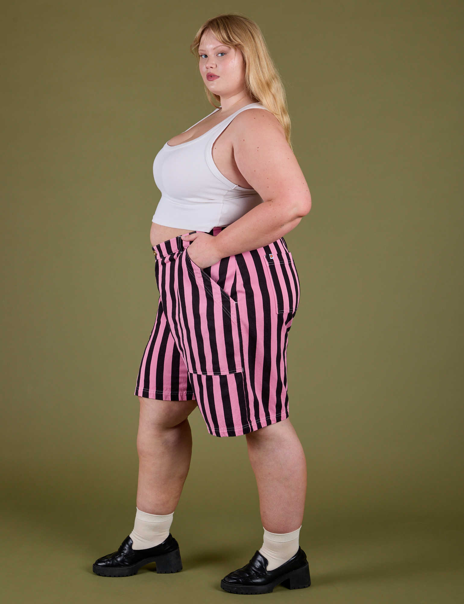 Side view of Longline Work Shorts in Bubblegum Pink and vintage tee white Cropped Tank