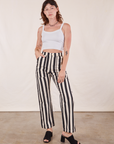 Alex is 5'8" and wearing XS Black Striped Work Pants in White paired with vintage off-white Cropped Cami