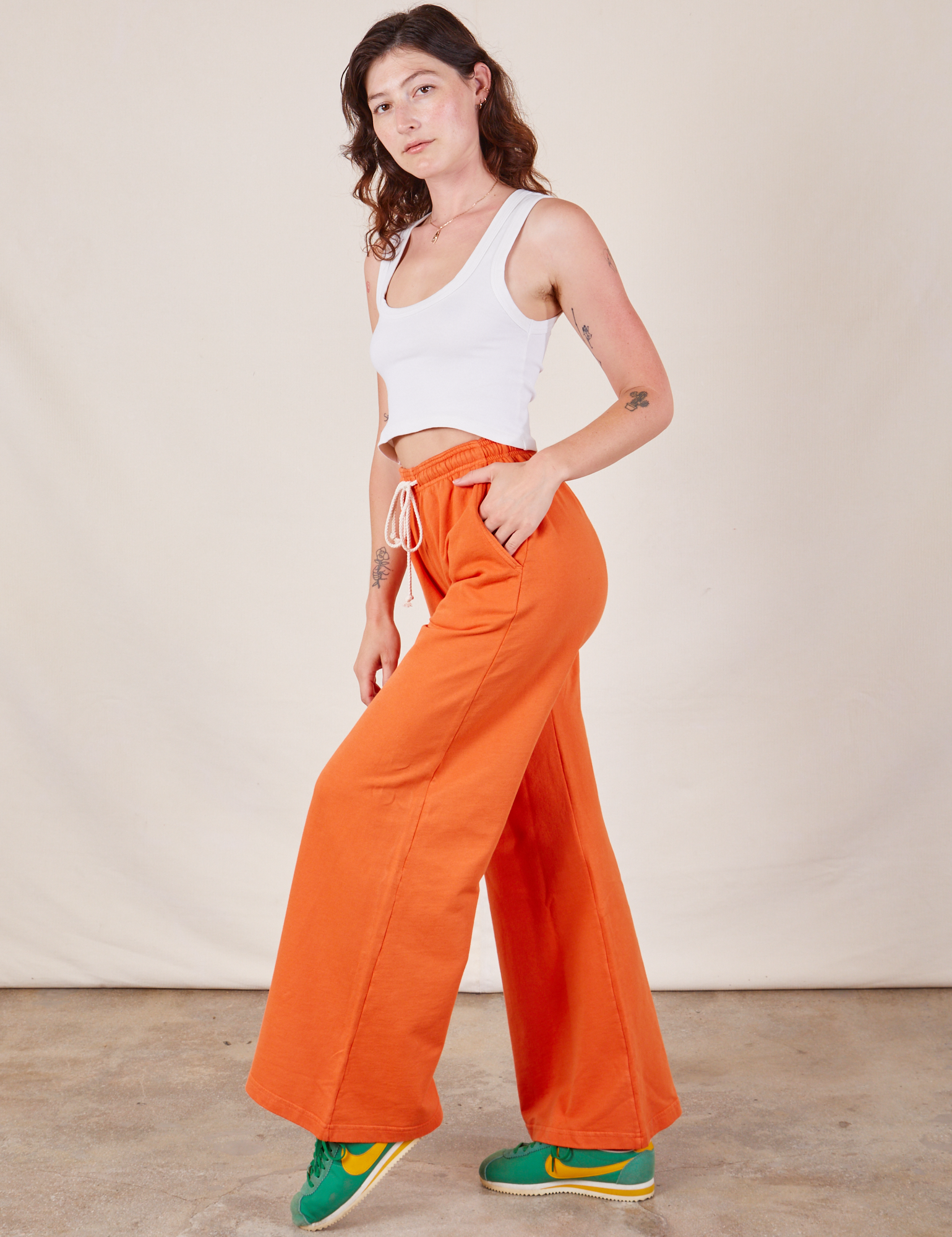 Wide Leg Sweat Pants in Sunset Orange side view on Alex