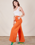 Wide Leg Sweat Pants in Sunset Orange side view on Alex