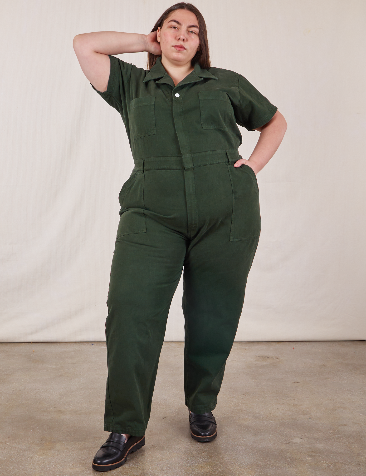 Marielena is 5’8” and wearing 2XL Short Sleeve Jumpsuit in Swamp Green