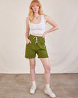 Margaret is wearing Lightweight Sweat Shorts in Summer Olive and Cropped Tank in vintage tee off-white