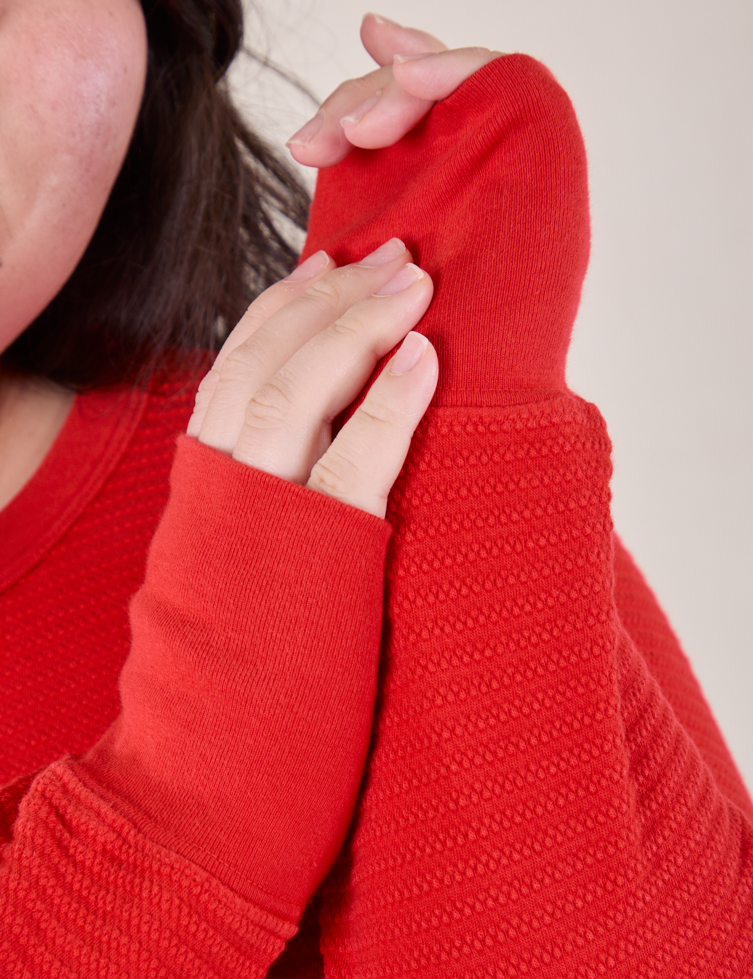 Honeycomb Thermal in Mustang Red sleeve cuff close up on Ashley