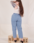 Back view of Denim Trouser Jeans in Light Wash and vintage off-white Sydney Tank Top