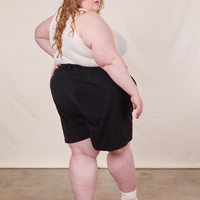 Back view of Trouser Shorts in Basic Black and vintage off-white Tank Top worn by Catie