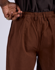 back view close up of Pleated Trouser Shorts in Fudgesicle Brown
